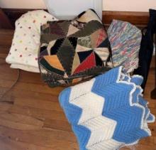 quilts and an Afghan, and a rag rug