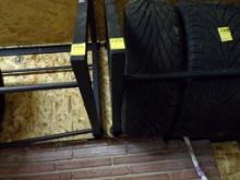 (2) Wall Mount Tire Racks, Both Have A Bent Bar, BUYER IS RESPONSIBLE FOR R