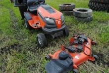 2011 Husqvarna YTH24V48 riding mower with 48" deck, has bagger, safety switch is sticky, runs & driv