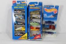 Hot Wheel cars. New in packages. Count 23.