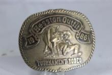 1986 Hesston Outfit Tournament Rodeo brass belt buckle PRCA series 2