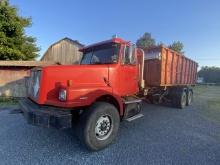 1999 Volvo WG64 Rolloff Truck with Container