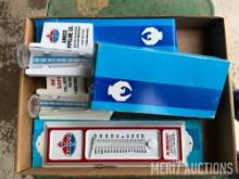 Flat of Amoco rain guages & thermometers
