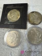 Group of four vintage Silver dollars