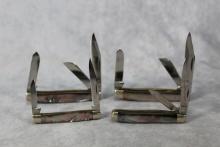 GROUP OF FOUR QUEEN CUTLERY BLACK MOTHER OF PEARL KNIVES