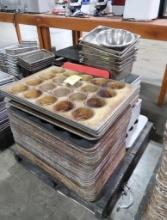 pallet of muffin pans, loaf pans, stainless pans