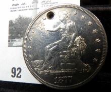 1877 S U.S. Silver Trade Dollar. Holed.
