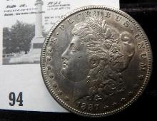 1887 S Morgan Silver Dollar. AU. Lite toning.