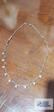 Silver colored chain with clear gemstones marked 925 CZ