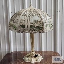 Antique slag...glass lamp with pond scene and metal base. 24 in. tall, base of glass is 17 in. wide