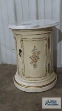 French Provincial marble top commode. 21 in. tall by 17 in. round