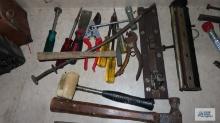 Lot of assorted tools including mallet, specialty hammer, claw hammer, chainsaw blade sharpener