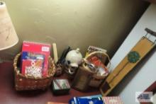 Miscellaneous items, including baskets,...word books, playing cards, light bulbs, wall calendar