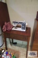 Janome sewing machine with cabinet in basement