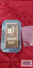 One grain 24 Karat gold 999.9 fine and one grain...999.9 gold