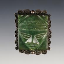 Vintage brooch with a jade figural insert.
