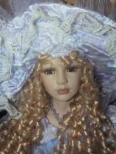 (GAR) Blonde Haired and Blue Eyed Porcelain Doll Wearing Blue/Purple Dress with Matching Hat and