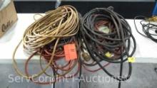 Lot on Table of Various Extension Cords