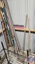 Fence posts, shovels, and broom handles