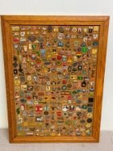 Group of Vintage Pins on Cork Board