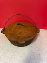 Vintage number eight cast-iron Dutch oven with lid
