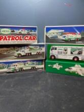 6 Hess toy trucks cars and planes. New in box