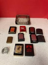Six zippo lighters and a vintage ashtray