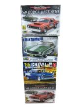 An AMT and Three Revell Classic Car Plastic Model Kits