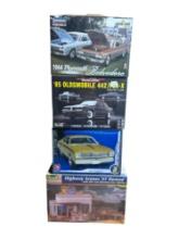 Four Classic Car Plastic Model Kits of Various Makers and Cars