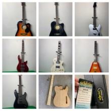 Group of Guitars With Significant Damage Plus Cases