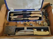 Box lot of bone handle carving sets, Coca-Cola belt buckle, and costume jewelry