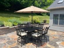 Outdoor patio table with high top chairs and umbrella