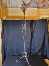 Early wrought iron floor lamp with leaf accents