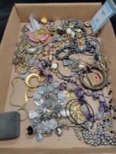Flat box of assorted costume jewelry, some sterling