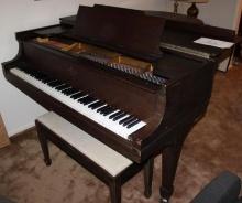 Steinway and Sons Baby Grand Piano with Dark Wood Finish
